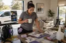 marketing materials, business cards, and a yard sign laid out on a workbench, in a natural documentary style.