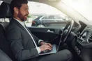 A smartphone showing a Google Maps search for car rentals with nearby listings and star ratings, documentary style.