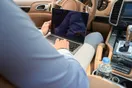 A person filming a short phone video of a clean rental SUV on a lot, in a natural documentary style.