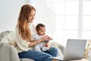 A daycare owner at a laptop reviewing a Facebook page with photos of a classroom, warm home-office setting, documentary style.