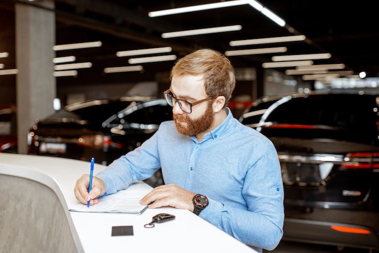How do I set up and register a car dealership?